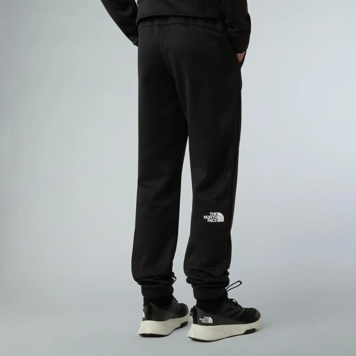 NF0A8EB7 TEEN REAXION JOGGER NERO THE NORTH FACE